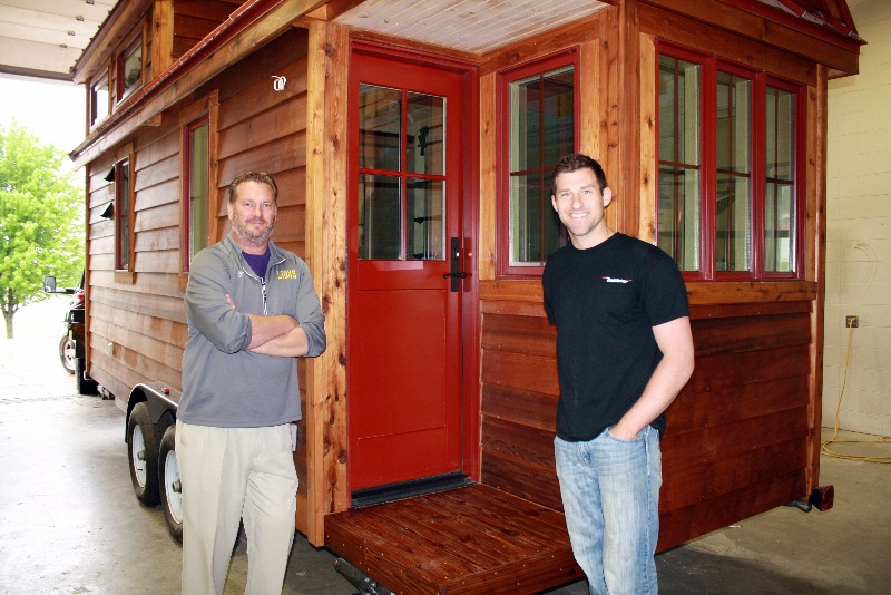 Mr. Ackerman and Mr. Engel at the front door of the completed tiny house.